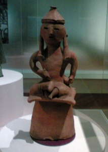 Haniwa terracotta figurine of a man sitting cross-legged